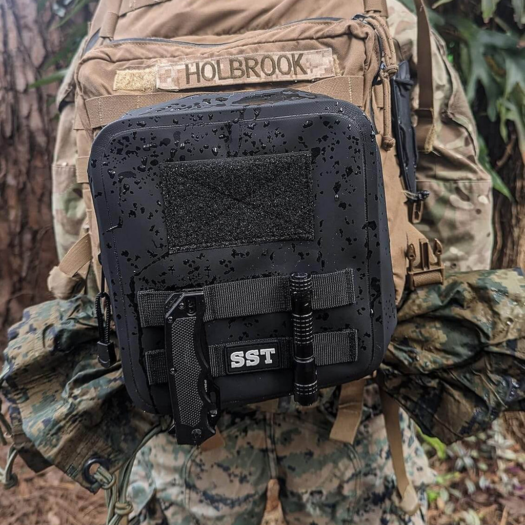 Close-up of SealBags waterproof tactical MOLLE pouch attached to a backpack, showcasing its durable design.